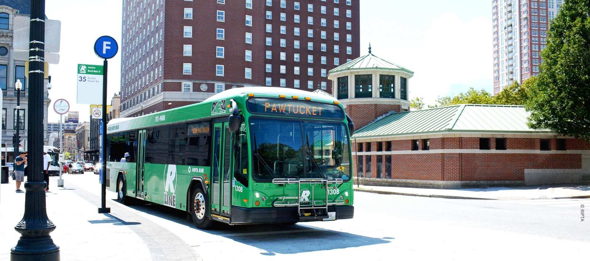 RIPTA bus driving in the city of Providence.