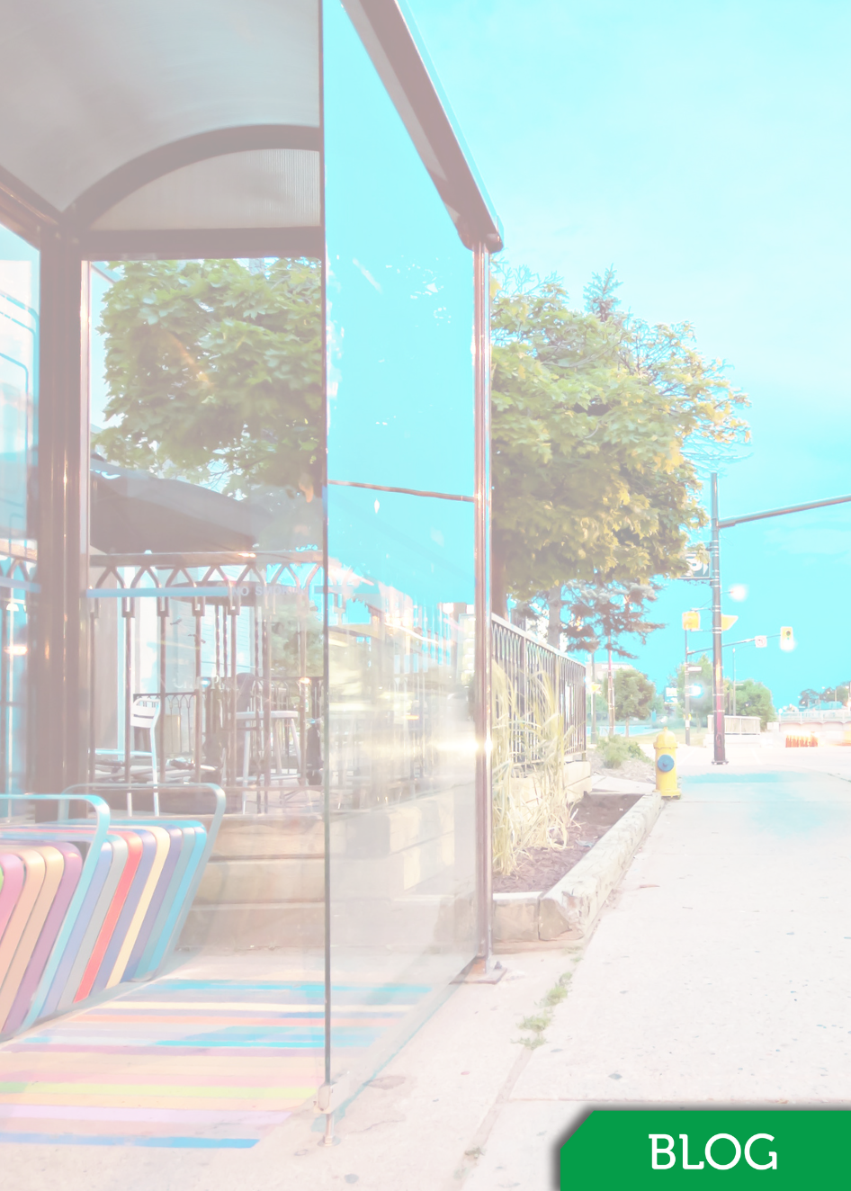 Brightly colored bus stop with moving bus