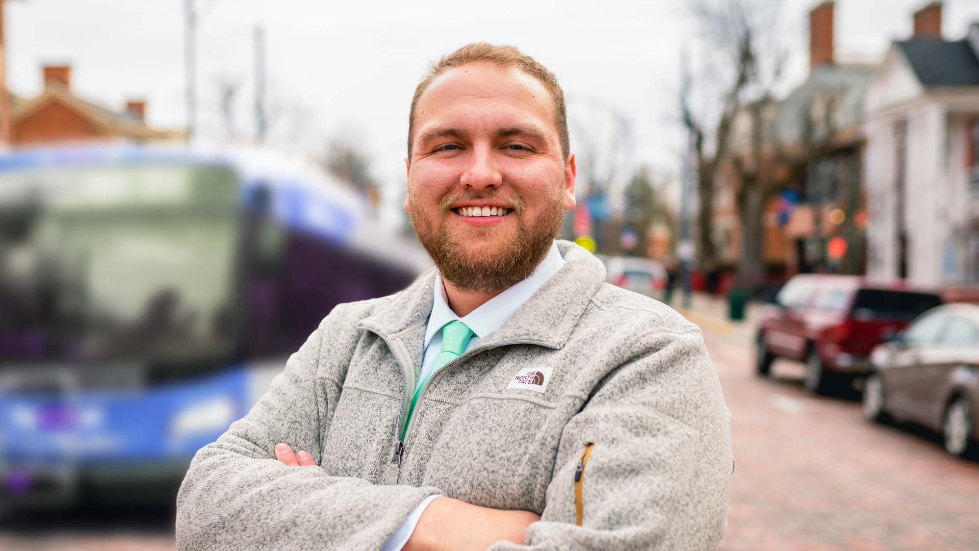 Man in front of bus